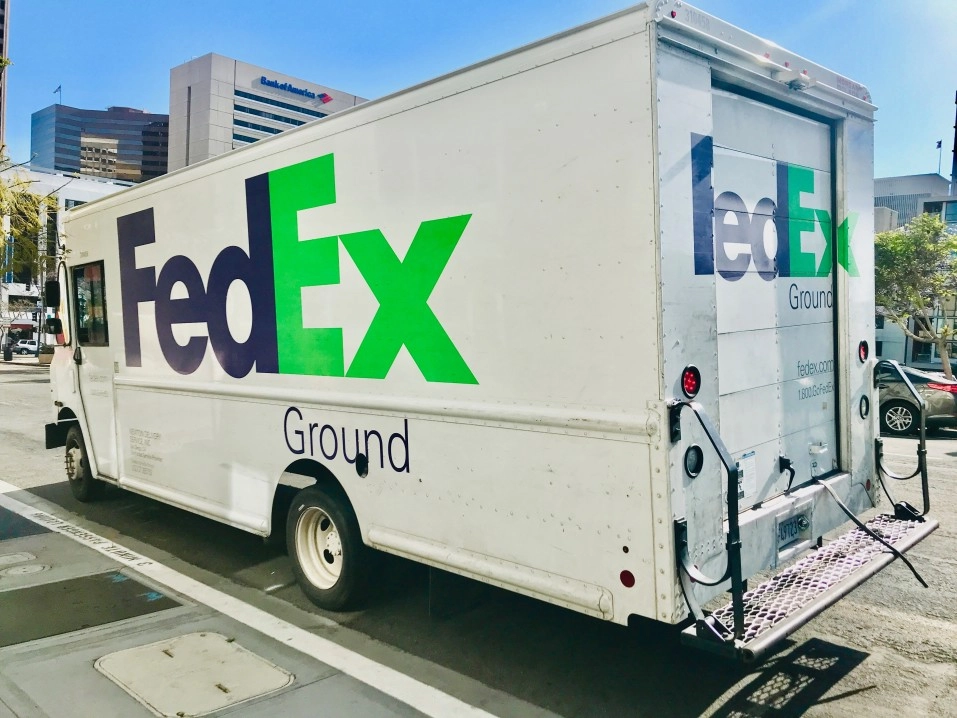fedex truck delivering a package