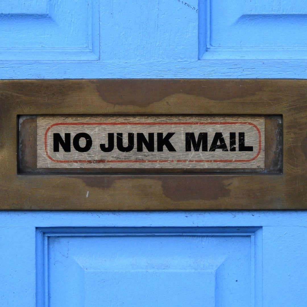 door with sign reading No Junk Mail