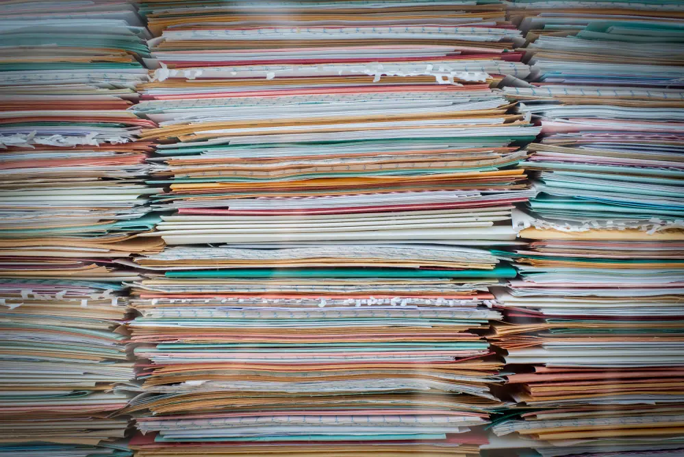a lot of documents stacked on top of the other