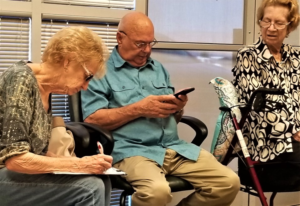 elderly person on a phone