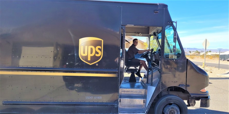 ups driver delivering packages