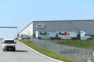 building with shipping trucks outside