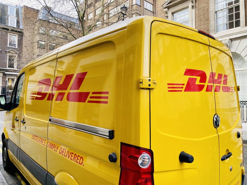 DHL truck delivering a package
