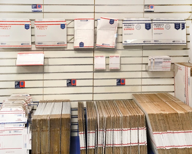 usps packages at a post office shelf