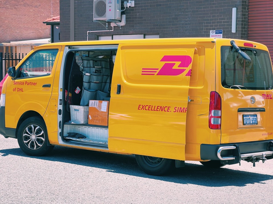 dhl driver delivering a package