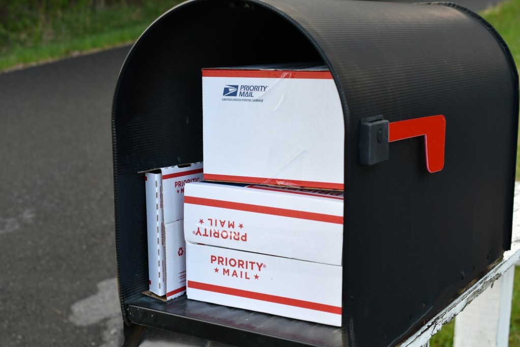 priority mail packages in a mailbox