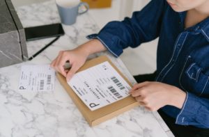 adding a shipping label on a package
