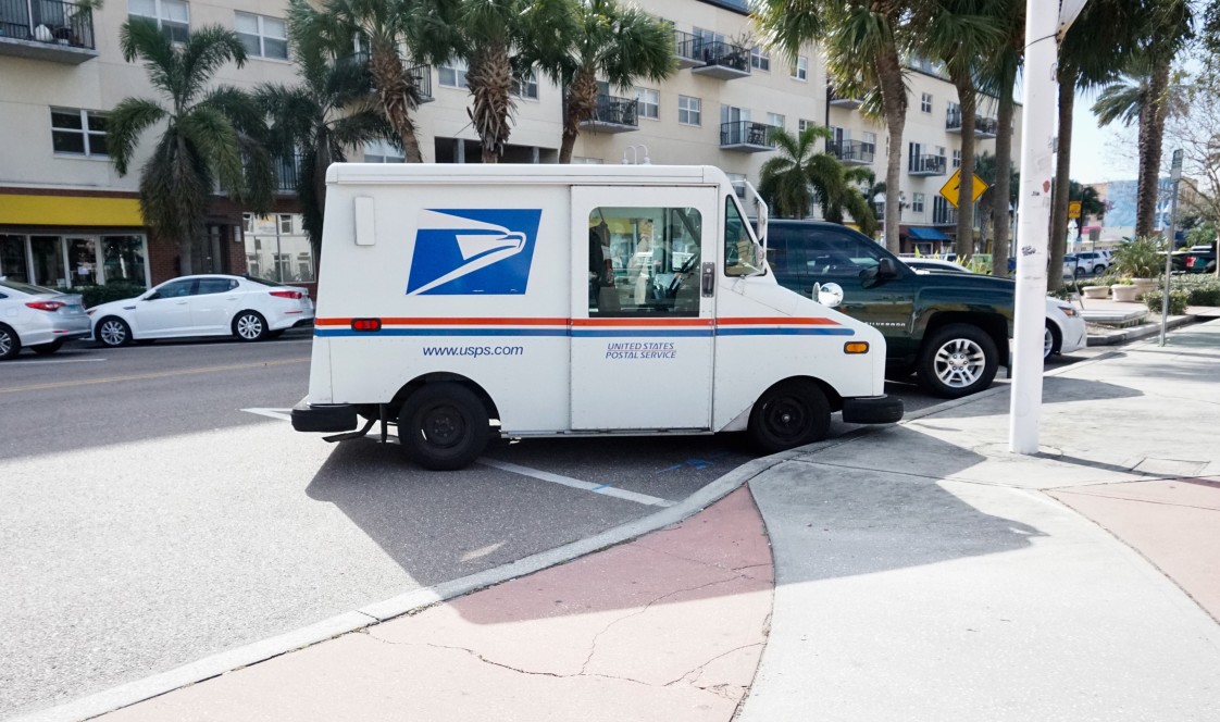 usps truck on the side of the road