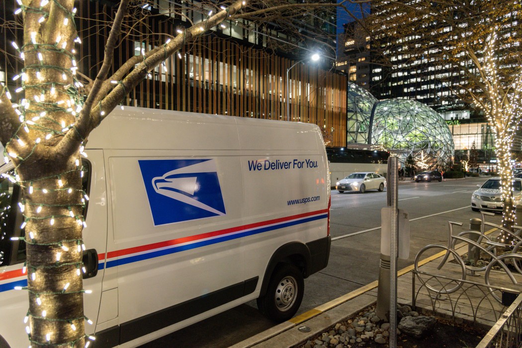 usps truck delivering packages at night