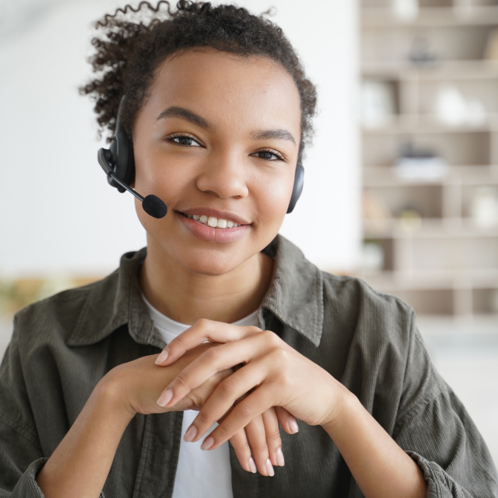 girl with headphones and a mic working at home