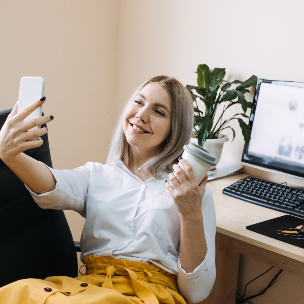 girl takes a selfie in her home office