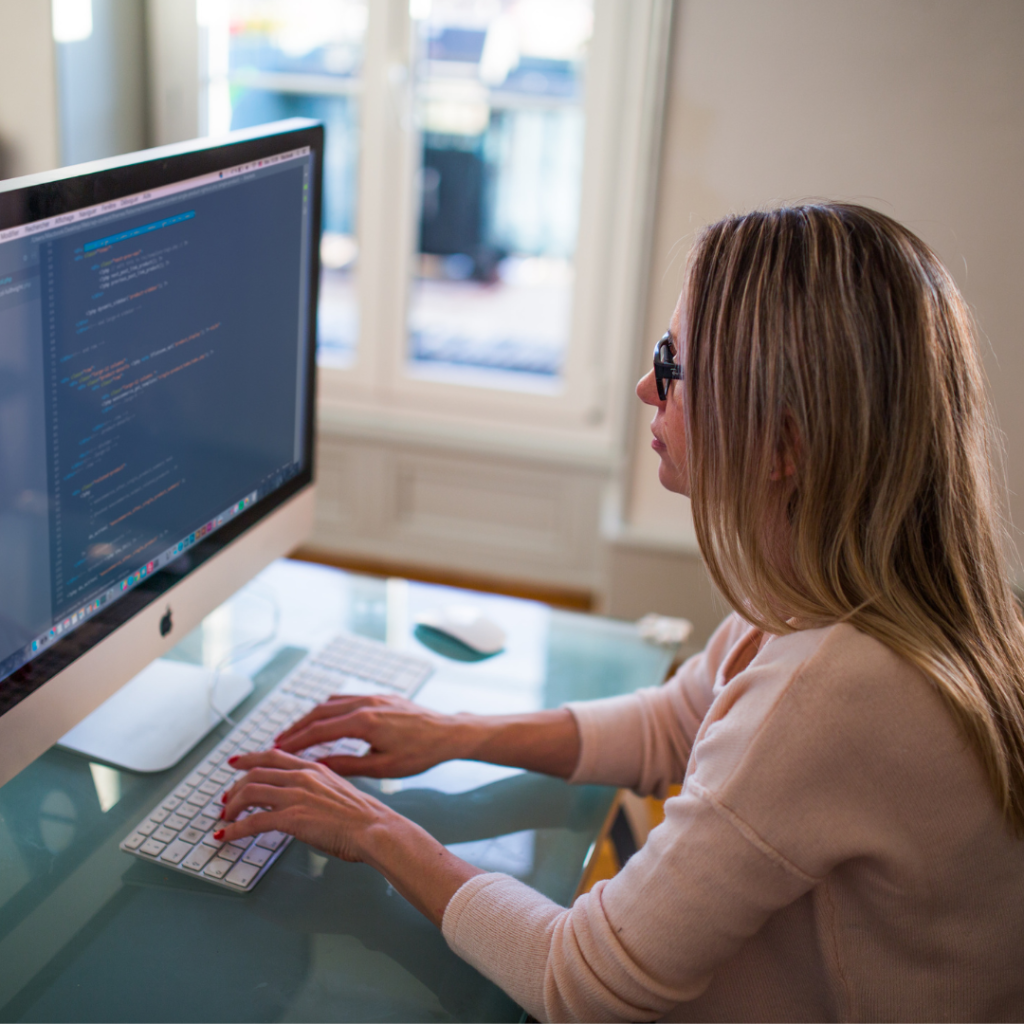 girl coding in her home office