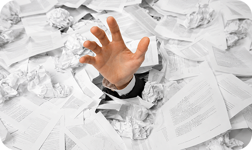 Person overwhelmed by paper mail clutter, illustrating the need for a virtual mailbox solution